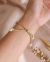 Pulseira Búzios Natural Linha Dourada - comprar online