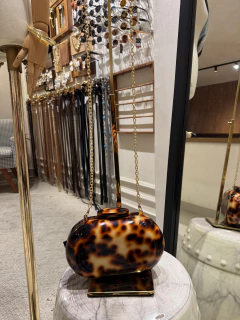 Clutch Animal Print na internet