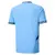 Camisa masculina azul do Manchester City 24/25 vista de costas com detalhes na gola e nas mangas