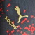Camisa AC Milan Edição especial 23/24 - Jogador Puma Masculina - Preta e vermelha com detalhes em dourado - Trajando Grifes - Futebol e NBA