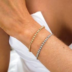 Bracelete aro com pequenas esferas lisas, banhado a Ouro 18k e Ródio Branco.