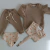 BUZO BEBÉ CON VOLADOS BEIGE - Mayorista llegar a ser