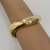 BRACELETE ONDULADO LISO ABRE E FECHA DOURADO - comprar online