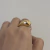 ANEL VOLTA GROSSA LADO ABERTO DOURADO - AJUSTÁVEL na internet