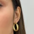 BRINCO ARGOLA DESIGN ENTRELAÇADO DOURADO - comprar online