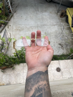 Lupa de mola armação dourada