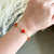 Pulseira trevo vermelho- aço inoxidável ouro18k - comprar online
