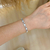 Pulseira cravejada e madre pérola - ouro branco - loja online