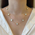 Colar 7 trevos branco tradicional - aço inoxidavel ouro 18k