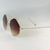 Oculos triangulo dourado, lente marrom. - USE MALLU - SEMI JÓIA 
