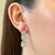 Brinco tres pedras - ouro branco - comprar online