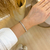Bracelete cravejado geometrico aberto - ouro branco