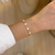 Pulseira cravejada e madre pérola - ouro18k