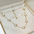 Colar 7 trevos branco tradicional - aço inoxidavel ouro 18k - loja online