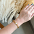 Bracelete elos com trevo branco - aço inoxidável ouro18k - comprar online