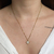 Colar trevo com ponto de luz branco- aço inoxidavel ouro18k - comprar online