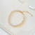Pulseira riveira 2p navete - ouro18k na internet