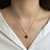 Colar trevo com ponto de luz preto - aço inoxidavel ouro18k - comprar online