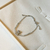 Pulseira urso cravejado - ouro branco na internet