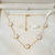 Colar 5 trevos branco jard - aço inoxidavel ouro18k - loja online