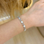 Imagem do Pulseira cravejada e madre pérola - ouro branco