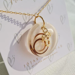 Pingente com cabelo e dente - loja online