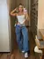 Calça Jeans Wide Cargo Recortes na internet