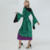 Fantasia Hocus Pocus para mulheres, com vestido verde e detalhes em preto e roxo, ideal para festas de Halloween.