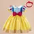 Fantasia de princesa Branca de Neve para bebês, com vestido amarelo, corpete azul e laço vermelho, acompanhada de faixa de cabelo.
