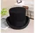 Chapéu fedora preto de lã, estilo steampunk, com aba larga e faixa na base.