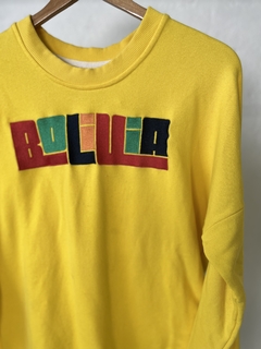 BUZO BOLIVIA AMARILLO CON LETRAS DE COLORES en internet