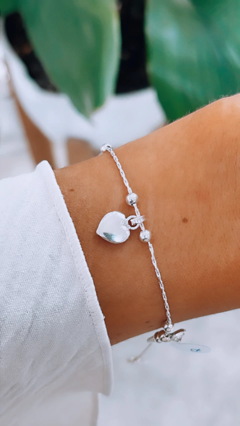 PULSERA DIJES COLGANDO CORAZON Y CUBICS