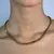 CORRENTE/PULSEIRA COM DETALHE EM FOLHA