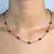 CORRENTE/PULSEIRA PEDRAS COLORIDAS FECHO BOIA - comprar online