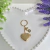 CHAVEIRO RELICÁRIO CORAÇÃO PET LOVE OURO - comprar online