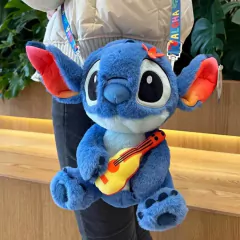 DISNEY - PELÚCIA COM BOLSO E ALÇA LILO E STITCH 25 CM - VIOLÃO - comprar online