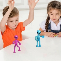 BONECO SENSORIAL ALIENÍGENA DIVERTIDO QUE ESTICA COM VENTOSA - ROSA na internet
