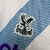 Camisa Crystal Palace II 23/24 Torcedor Macron - Branca e Azul Celeste