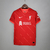 Camisa Liverpool I 21/22 Torcedor Nike - Vermelha e Bege - comprar online