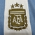 Imagem do Kit Infantil Argentina I 2024/25 Adidas - Branco e Azul (+ Patch Campeão Copa Mundo 2022)