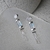 Brinco Agua Viva | Prata 950 | Topázio azul bicolor com quartzo cristal