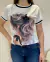 Camiseta Feminina T- shirt luxo, blusinha com aplicação em pedraria e fita na internet