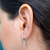 Argola Cravejada com Crucifixo - comprar online