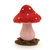 Cogumelo decorativo em tons de rosa e vermelho com detalhes brancos, medindo 13cm, sobre uma base com musgo.