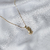 Colar Mãos Oração - Banhada a Ouro 18k - comprar online