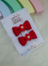 Par de mini gravatinha com florzinha.
