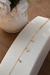 Pulseira flor com com pingo de strass - comprar online