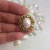 Imagem do kit 50 Tag Oval Dourada + 50 Chaton 10x14mm