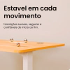 Mesa com Regulagem de Altura DT3 F10 com tampo de madeira clara, destaque para estabilidade e três esferas metálicas sobre a superfície.