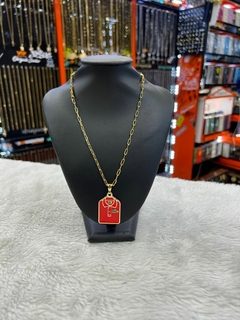 Corrente aço/banhado dourado.
